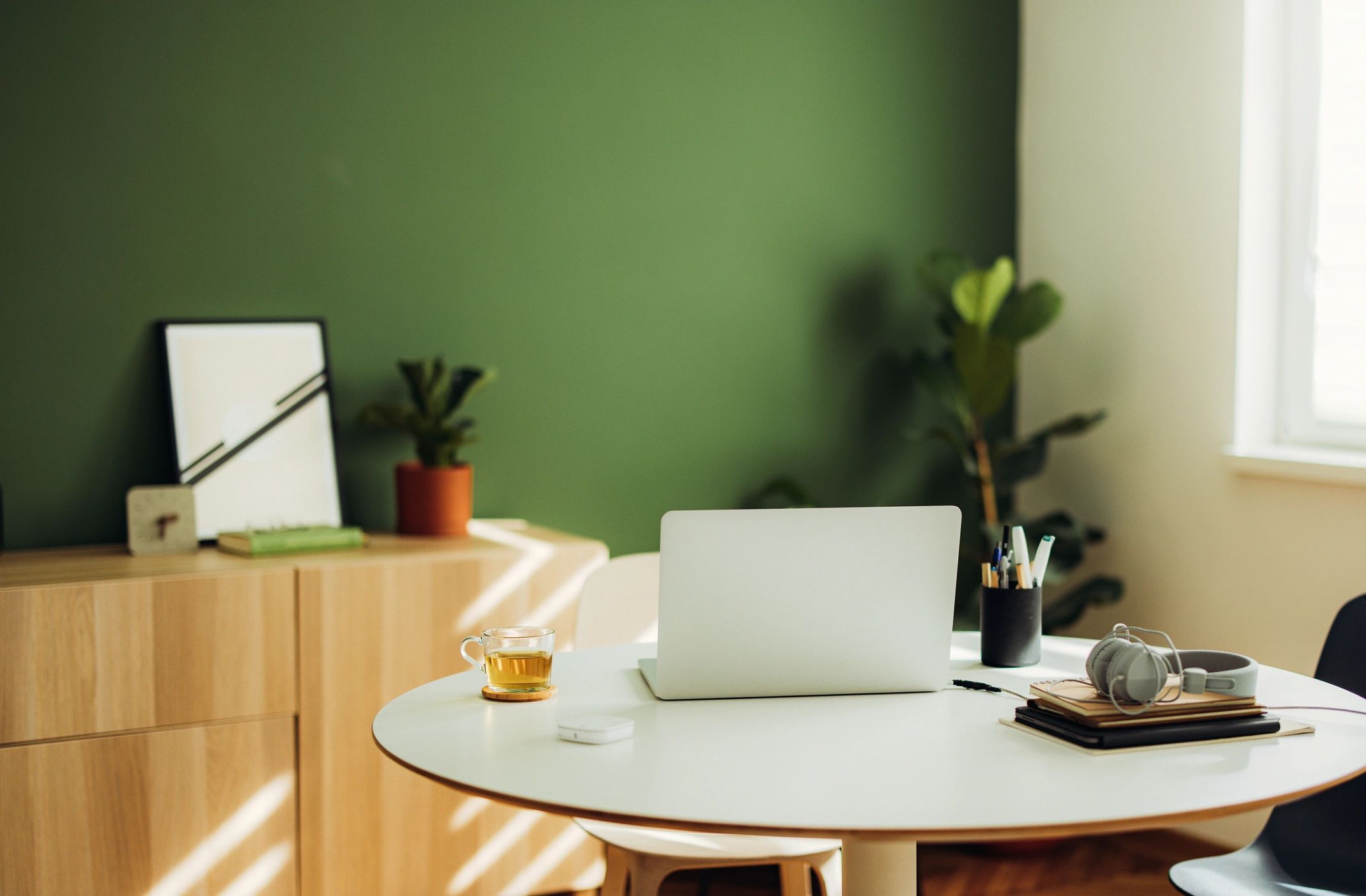 Modern office desk with laptop and website design planning materials