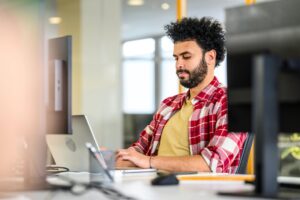 Man working on computer in office