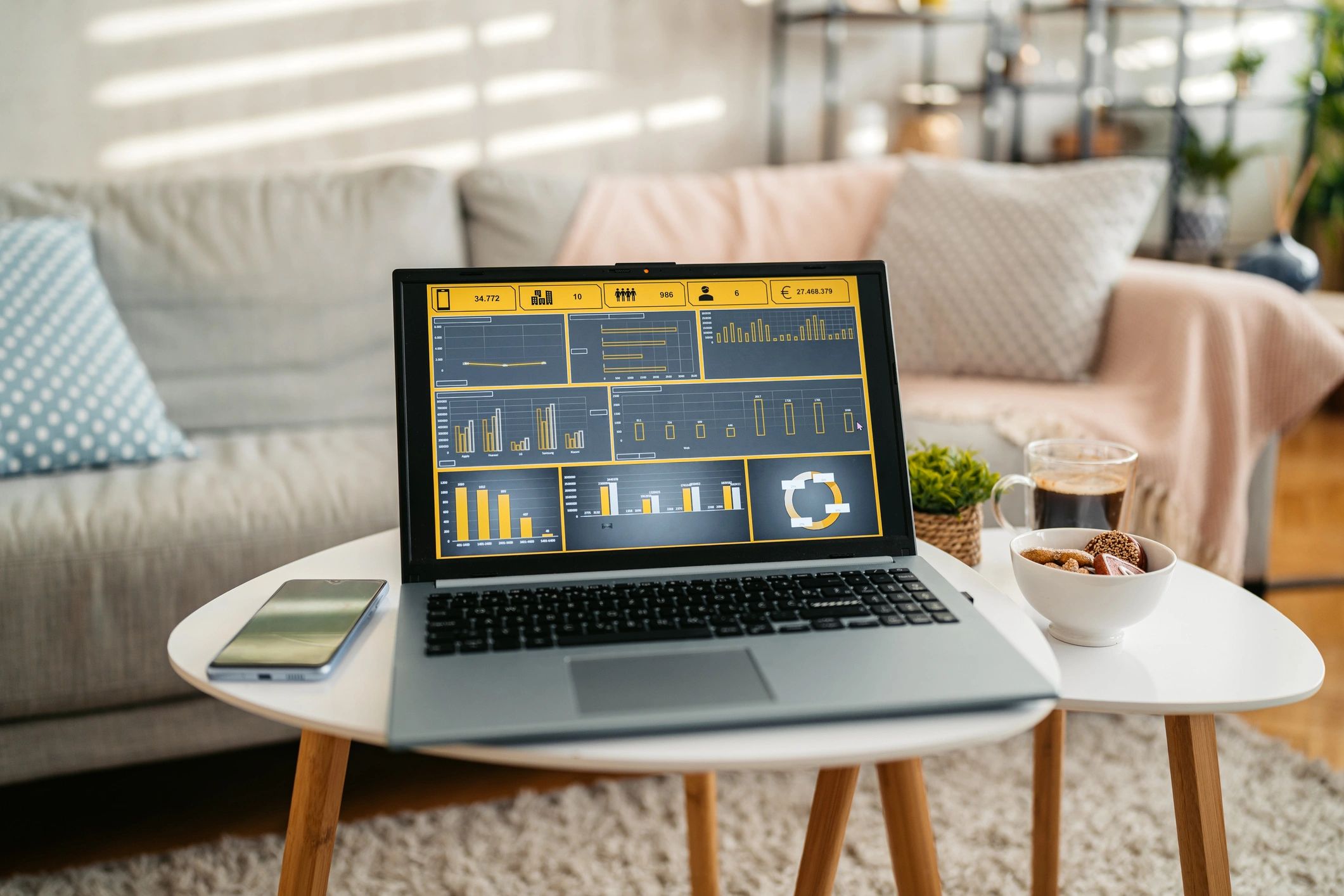 Laptop with charts representing analytics and reporting